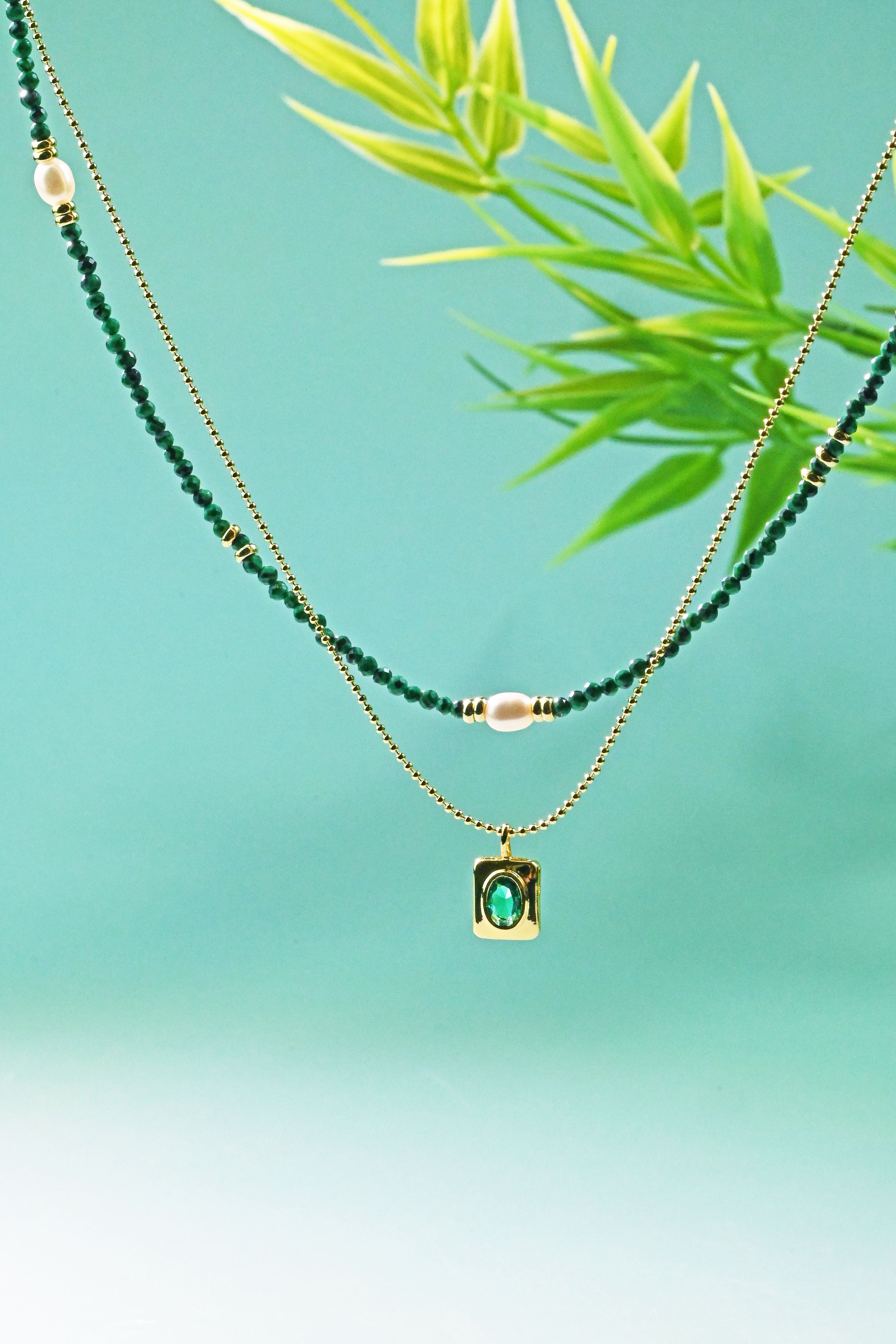 The Harmonious Dance of Light and Nature: A Layered Emerald Green Pearl Necklace of Timeless Elegance